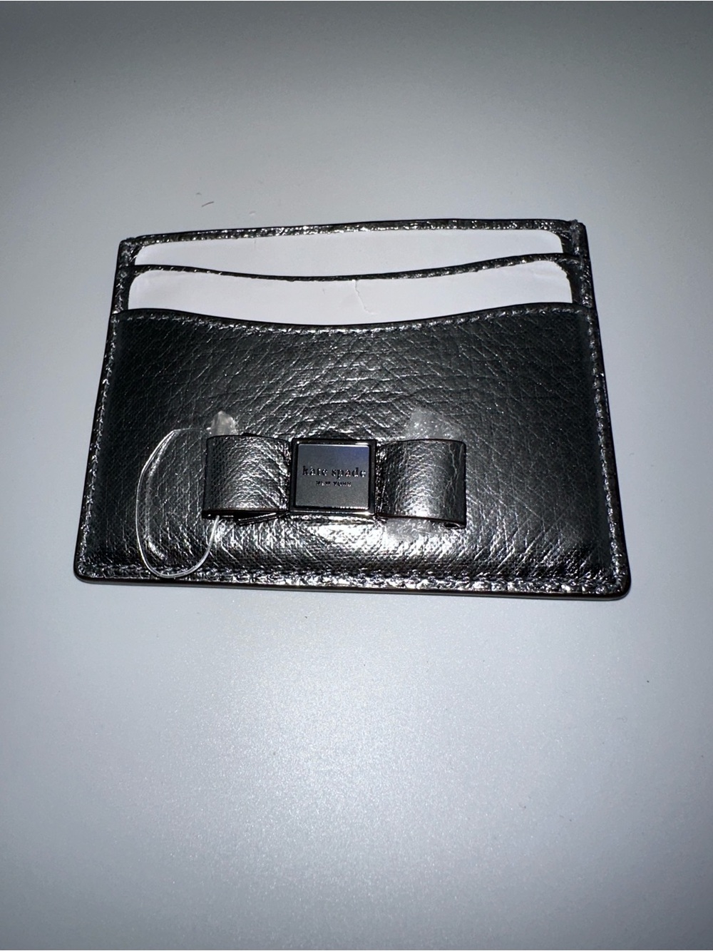 kate spade Metallic Silver Leather Card Case with Bow Accent